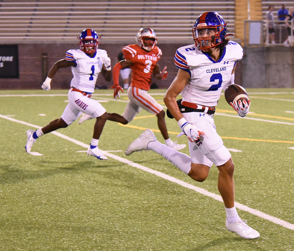 Staff Photo by Matt Hamilton / Cleveland (2) Destun Thomas looks back while running for a touchdown after catching a long pass Friday. Eight local football teams squared off in eight different 20-minute games Friday, August 13, 2021 at Finley Stadium.
