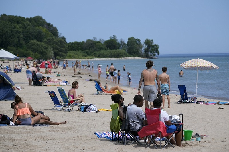 People enjoy a hot summer day Thursday, Aug. 12, 2021, at Bradford Beach in Milwaukee. (AP Photo/Morry Gash)


