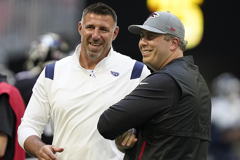 AP photo by Brynn Anderson / Head coaches Mike Vrabel of the Tennessee Titans, left, and Arthur Smith of the Atlanta Falcons speak before their team's preseason opener Friday night in Atlanta.