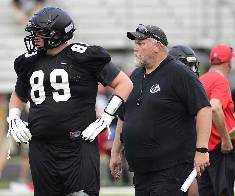 Staff photo by Robin Rudd / Ridgeland football coach Kip Klein and lineman Jacob Klein, his son, watch as the Panthers host scrimmages against Chattooga, Dade County and Gordon Lee on July 13.