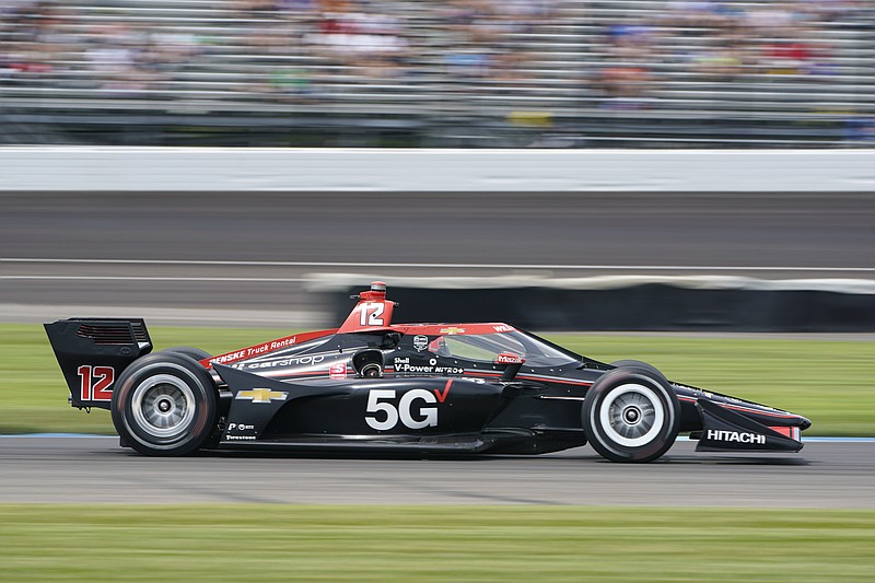 AP photo by Michael Conroy / Will Power drives through a turn during Saturday's race on the road course at Indianapolis Motor Speedway.