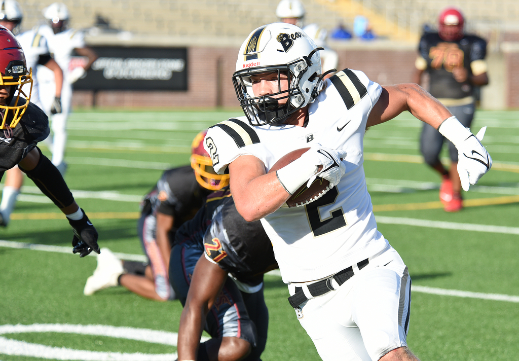 Staff Photo by Matt Hamilton / Bradley Central (2) Knox Watson finds running room against Howard Saturday. Eight local football teams squared off in eight different 20-minute games Saturday August 14, 2021 at Finley Stadium.