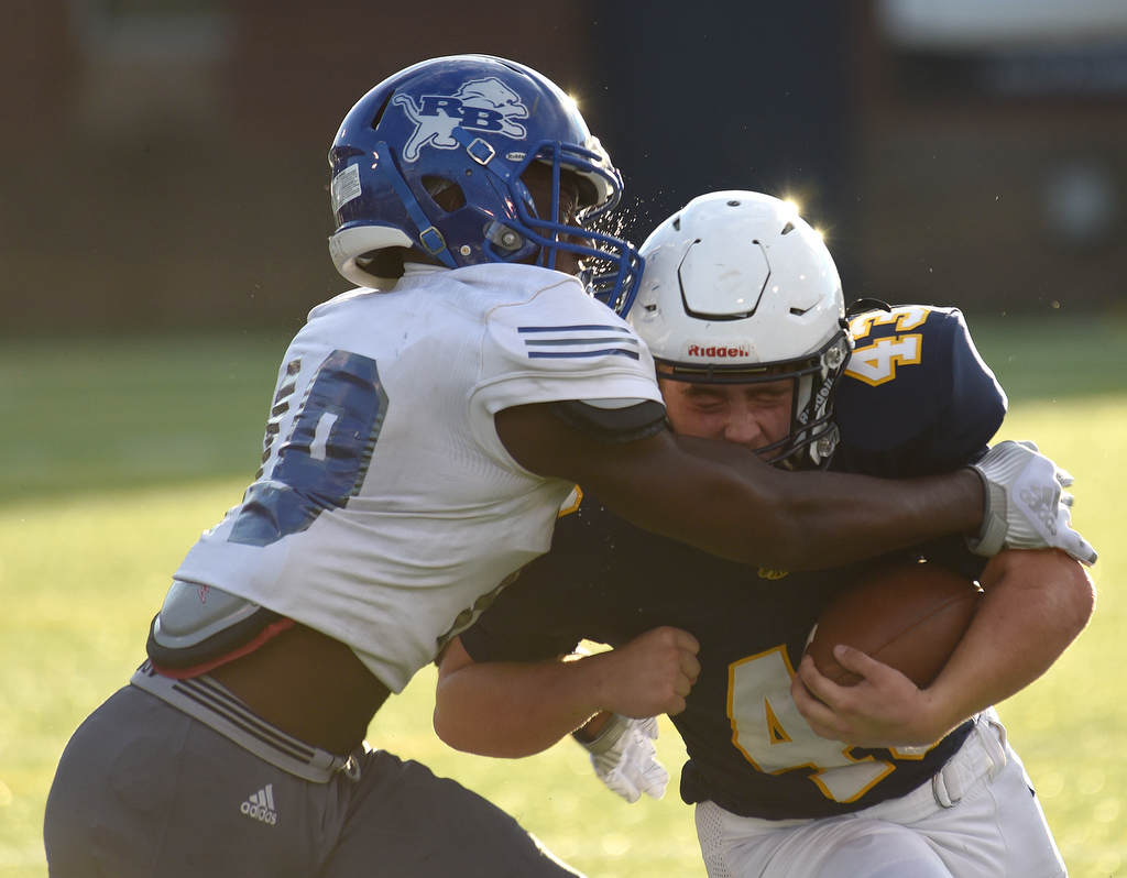 Staff photo by Matt Hamilton / Red Bank's Draden Collier, left, hits Walker Valley's Cameron Davis after Davis made a catch during a Best of Preps Jamboree matchup Saturday night at Finley Stadium. Red Bank beat both Walker Valley and South Pittsburg, and Baylor and East Hamilton also went 2-0 in scrimmage quarters.