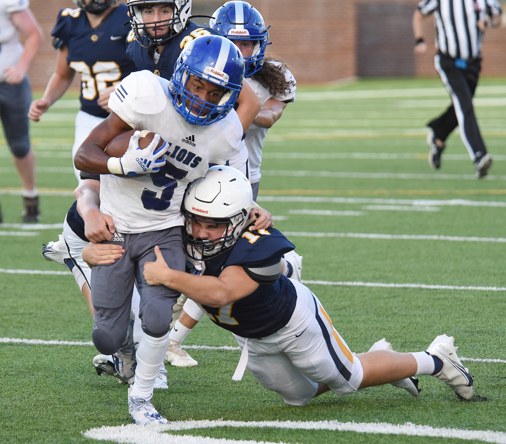 Staff Photo by Matt Hamilton / Walker Valley (17) Noah Green tackles Red Bank (5) Cordell Howard Saturday. Eight local football teams squared off in eight different 20-minute games Saturday August 14, 2021 at Finley Stadium.