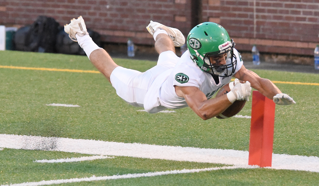 Staff photo by Matt Hamilton / East Hamilton's Jack Ralls dives for the pylon and scores a touchdown against Howard during the Best of Preps Jamboree on Saturday at Finley Stadium.