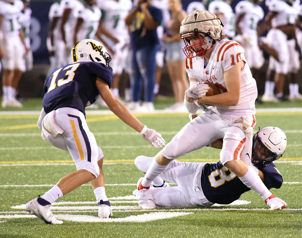 Staff Photo by Matt Hamilton / Baylor (10) Carson Yates carries the ball as Walker Valley (13) Cole Harbison and (8) Jheray Finley converge on him Saturday. Eight local football teams squared off in eight different 20-minute games Saturday August 14, 2021 at Finley Stadium.