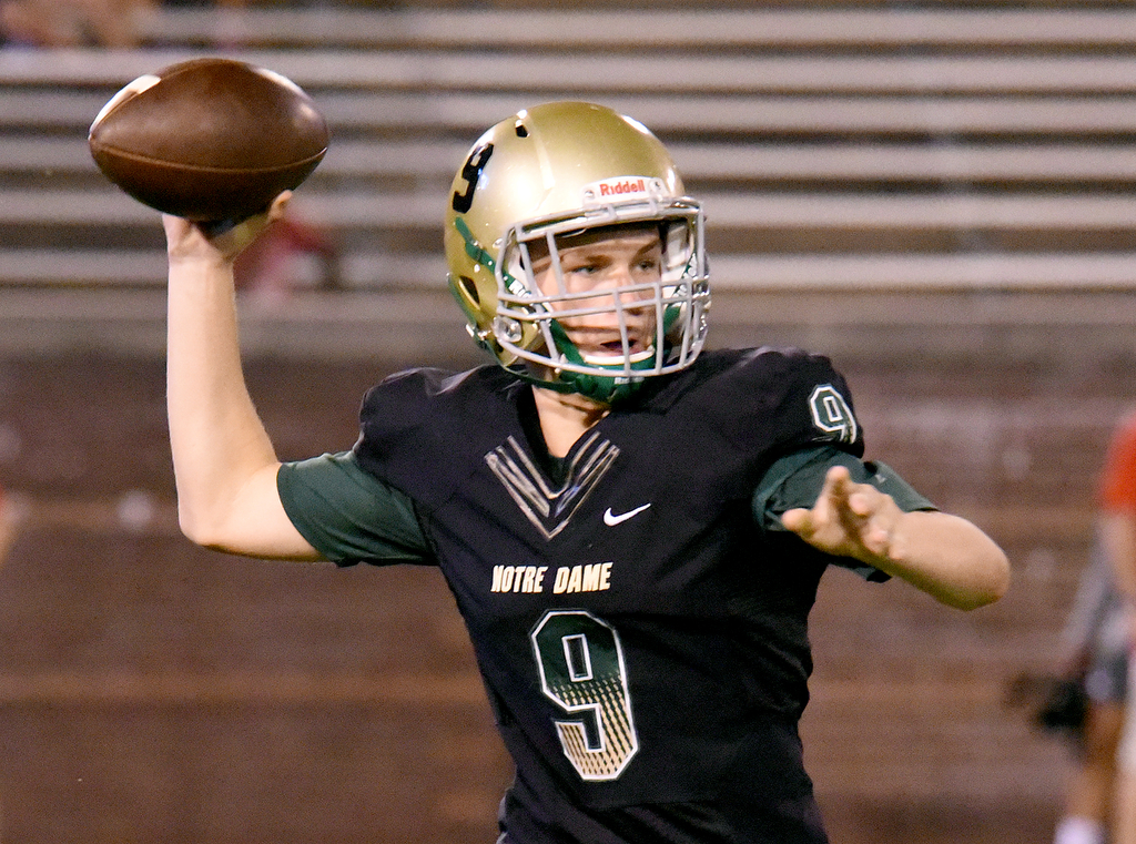 Staff Photo by Matt Hamilton / Notre Dame (9) Cash Bandy fires a pass against East Hamilton Saturday. Eight local football teams squared off in eight different 20-minute games Saturday August 14, 2021 at Finley Stadium.