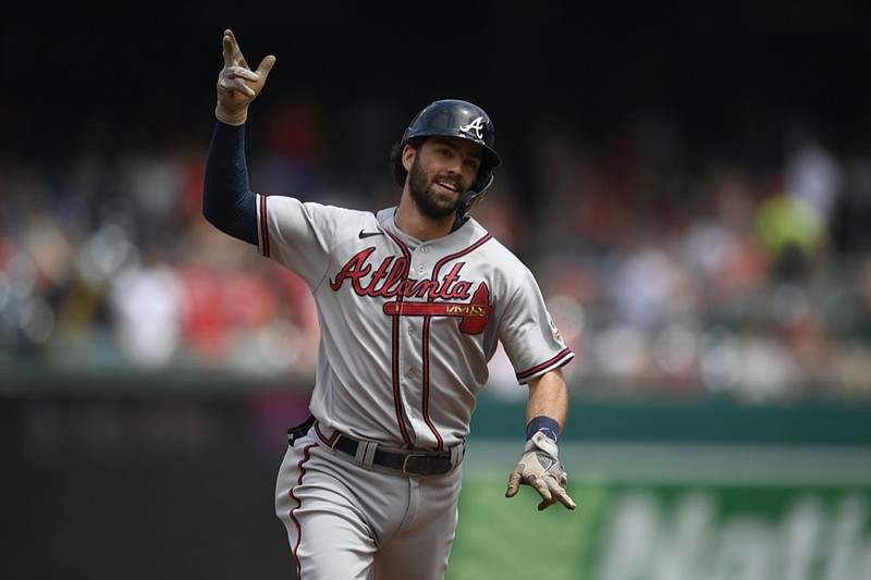Atlanta Braves' Dansby Swanson celebrates his two-run home run as he rounds the bases during the third inning of a baseball game against the Washington Nationals Sunday, Aug. 15, 2021, in Washington. (AP Photo/Nick Wass)


