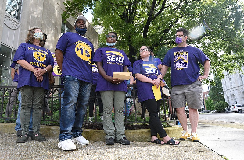 Staff Photo by Matt Hamilton / Alonzo Strickland, second from left, speaks during a Service Employees International Union press conference Tuesday. Representatives with the SEIU held a press conference to support Chattanooga Mayor Tim Kelly's budget on Tuesday, August 17, 2021 at the Chattanooga City Council building. 