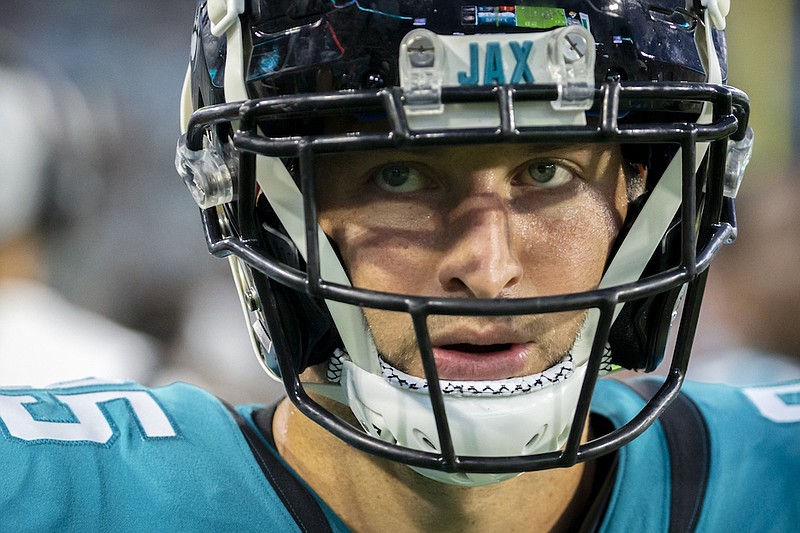 Jacksonville Jaguars tight end Tim Tebow paces the sideline during the first half of an NFL preseason football game against the Cleveland Browns, Saturday, Aug. 14, 2021, in Jacksonville, Fla. (AP Photo/Stephen B. Morton)