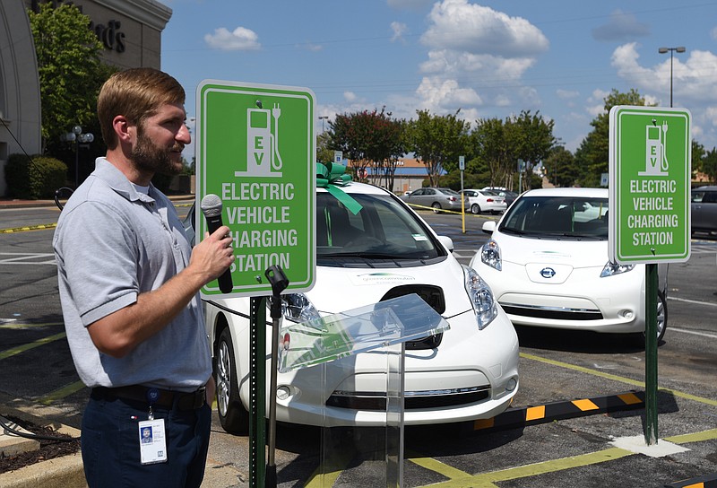 Staff photo by Angela Lewis Foster / TVA power utilization engineer Andrew Frye speaks at the celebration of Chattanooga's electric vehicle car share "First Plug-In" in 2016 at Hamilton Place Mall.