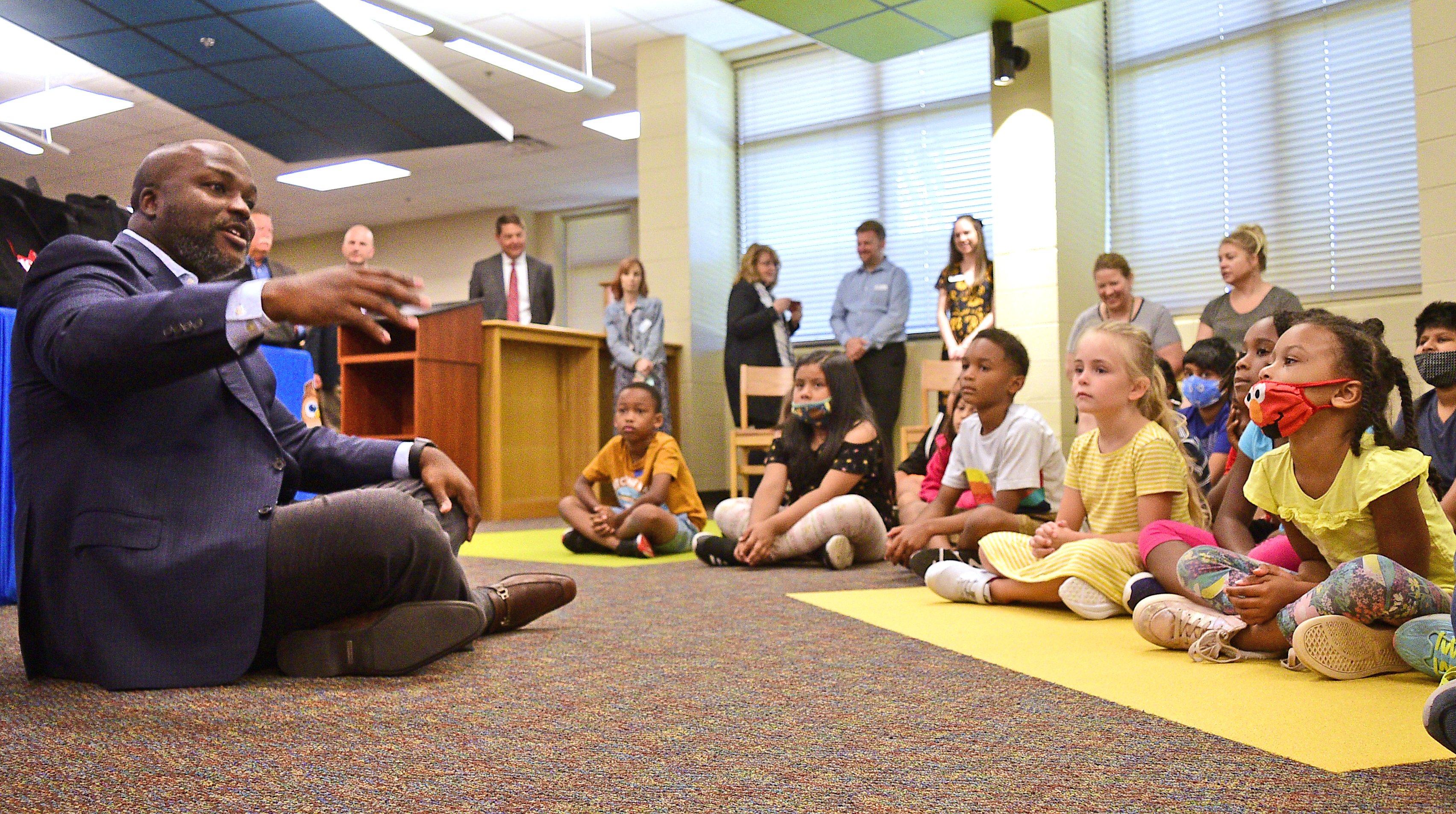 Staff Photo by Robin Rudd / Hamilton County Schools Superintendent Bryan Johnson talks to East Brainerd students about the importance of reading. The Governor's Early Literacy Foundation is continuing their K-3 summer book delivery program that provides free books to students and teachers in Tennessee. They're kicking off this year's event and giving away books at East Brainerd Elementary.