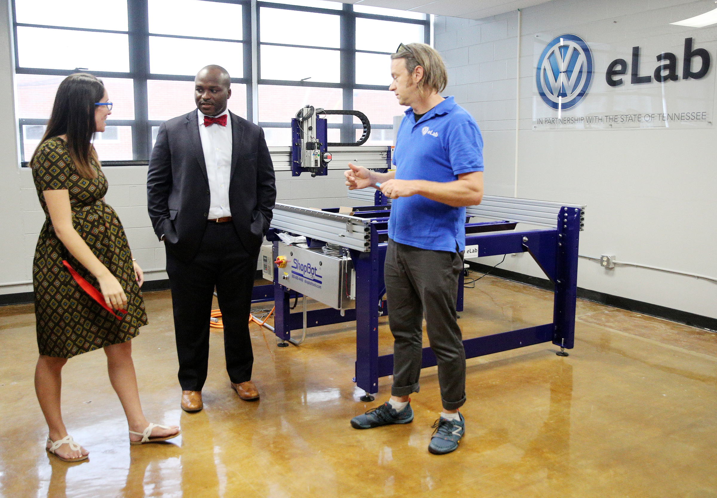 Olivia Bagby, STEM teacher, and Matthew Craig, VW eLab specialist, speak with Hamilton County Schools superintendent Bryan Johnson, center, Thursday, Aug. 10, 2017, at Red Bank High School in Red Bank, Tenn. Johnson toured several Hamilton County schools throughout the day.