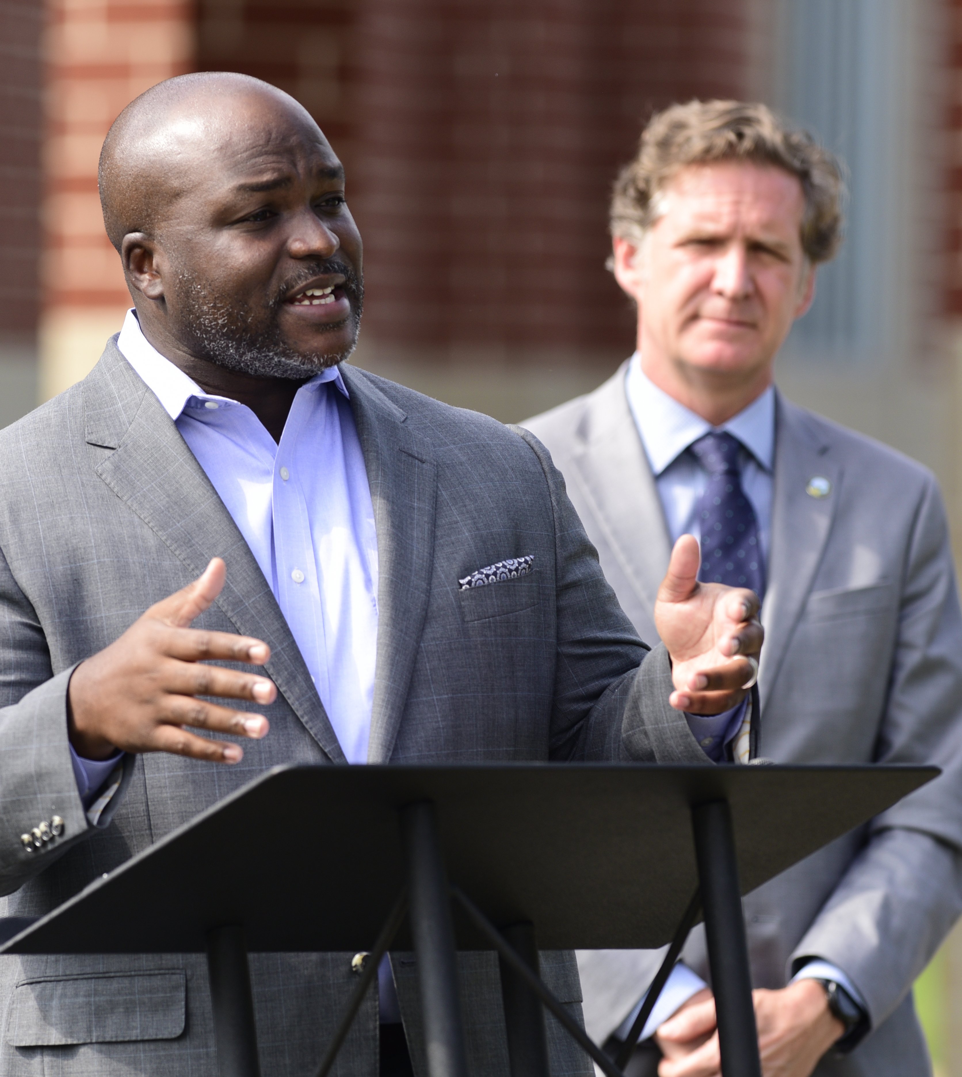 Staff Photo by Robin Rudd / Former Hamilton County Superintendent of Schools Bryan Johnson speaks during the press conference.. Mayor Tim Kelly announced Monday, in front of Orchard Knob Elementary School, that the city will fund seven positions in seven Hamilton County Schools within city limits to provide wraparound services for students. The decision is the first such investment by the city since the schools merged in 1997.