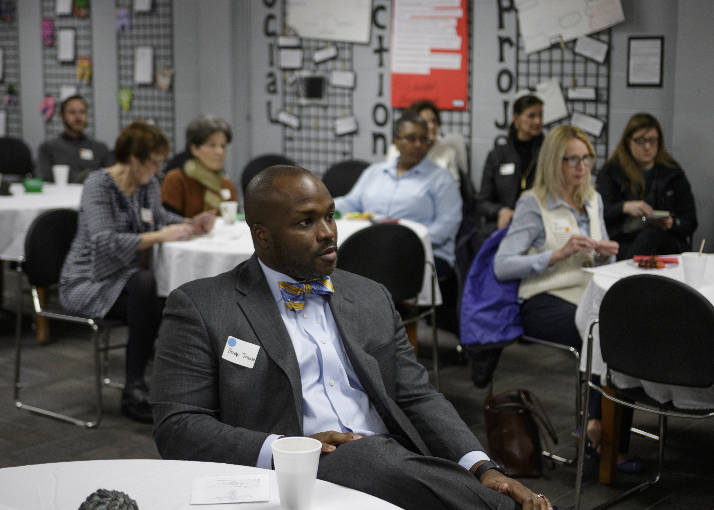 Schools Superintendent Bryan Johnson listens to a speaker at a one-year anniversary celebration for Red Bank Community School at Red Bank High School on Tuesday, Jan. 9, 2018, in Chattanooga, Tenn. The community school is a resource for both community members and students by offering services such as after-school programs and HiSET exam assistance.