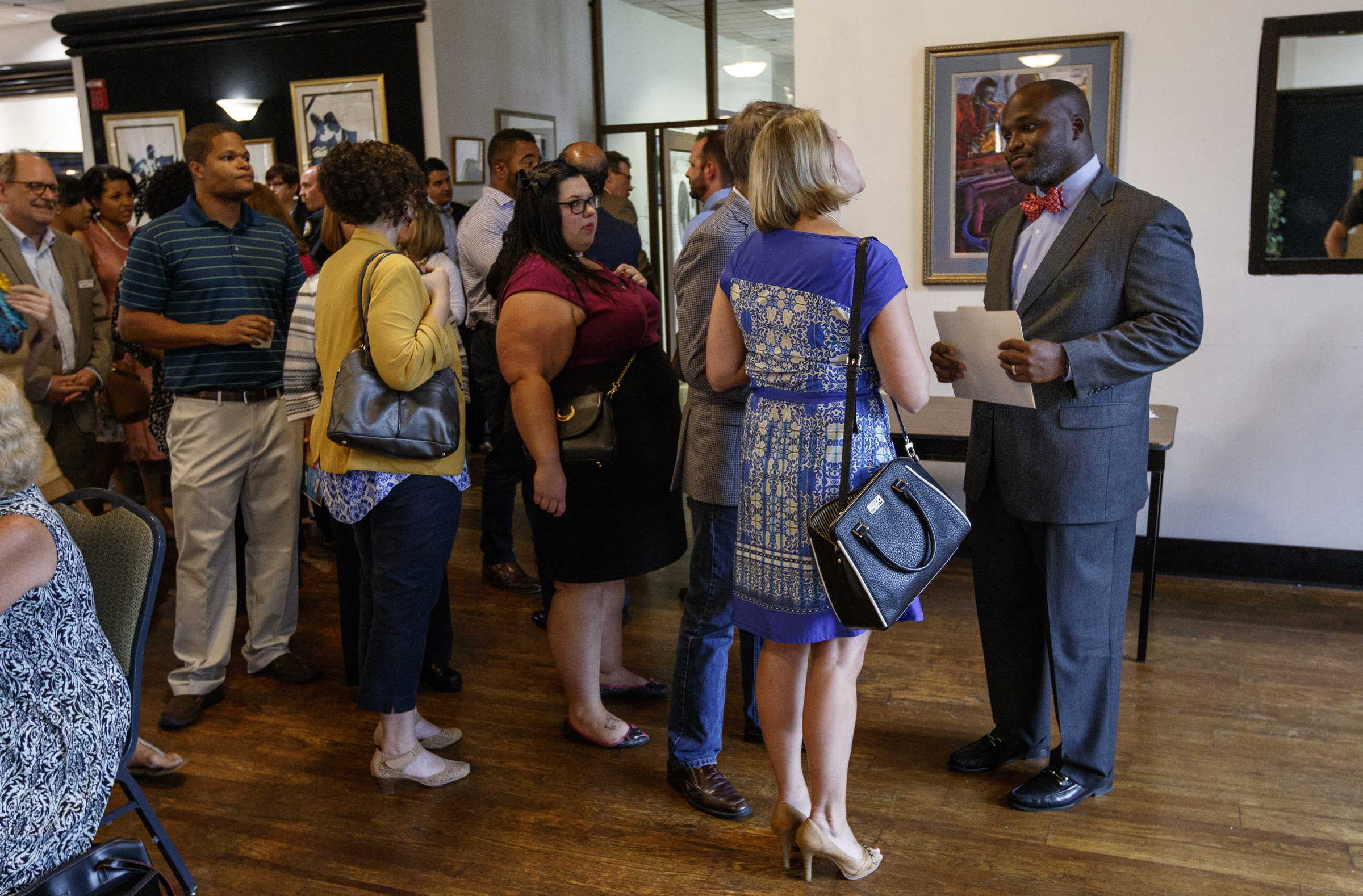 People line up to meet new Hamilton County Schools Superintendent Bryan Johnson, right, at a welcome reception hosted by the Urban League of Greater Chattanooga, Chattanooga 2.0, and UnifiEd at Bessie Smith Cultural Center on Tuesday, Aug. 8, 2017, in Chattanooga, Tenn. Johnson takes the helm as Hamilton County faces the potential state takeover of five low performing schools.