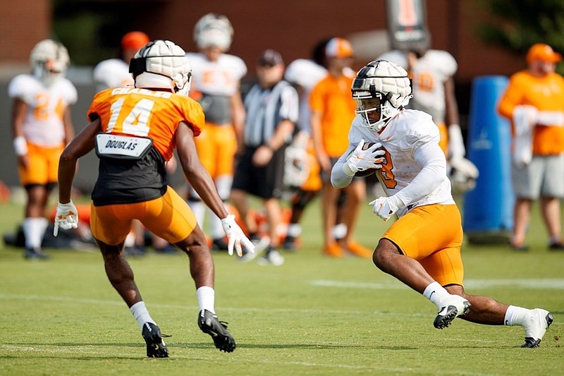 Tennessee Athletics photo / Freshman safety Christian Charles encounters junior running back Tiyon Evans during a recent Tennessee practice.