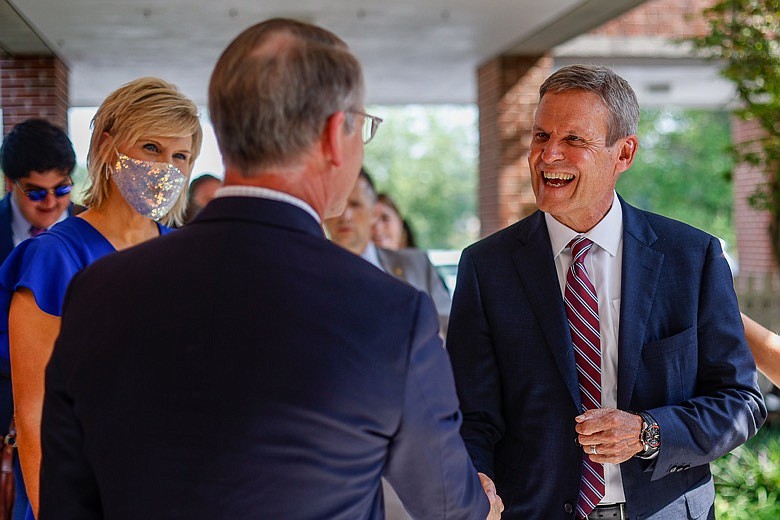Staff photo by Troy Stolt / Gov. Bill Lee is greeted by Tennessee Sen. Bo Watson after arriving at McConnell Elementary School on Wednesday, Aug. 11, 2021, in Hixson, Tenn to present the school with the Governor's Civic Seal award.