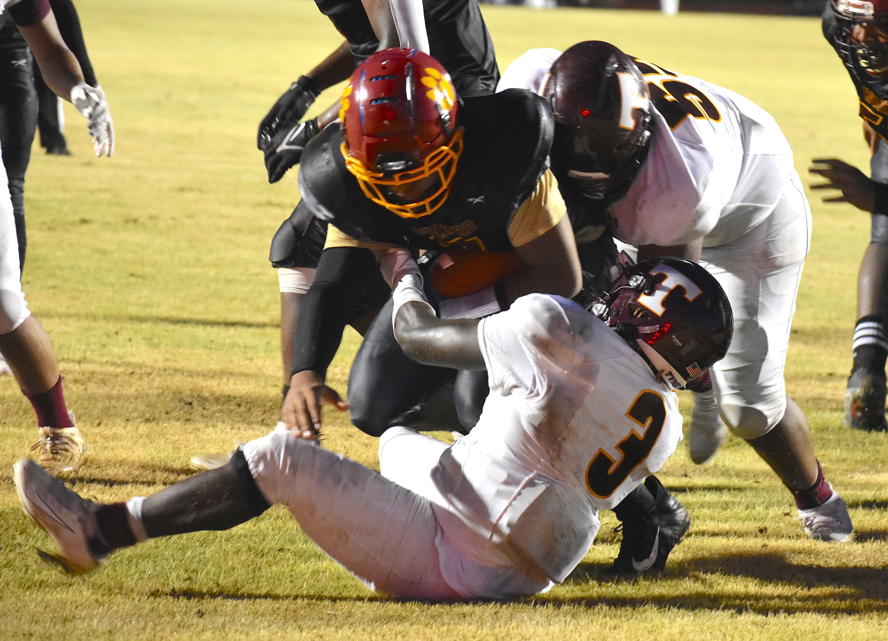 Staff photo by Patrick MacCoon / Tyner's Deonta Talor brings down the ball carrier during the Rams season opening win over Howard on Friday night.