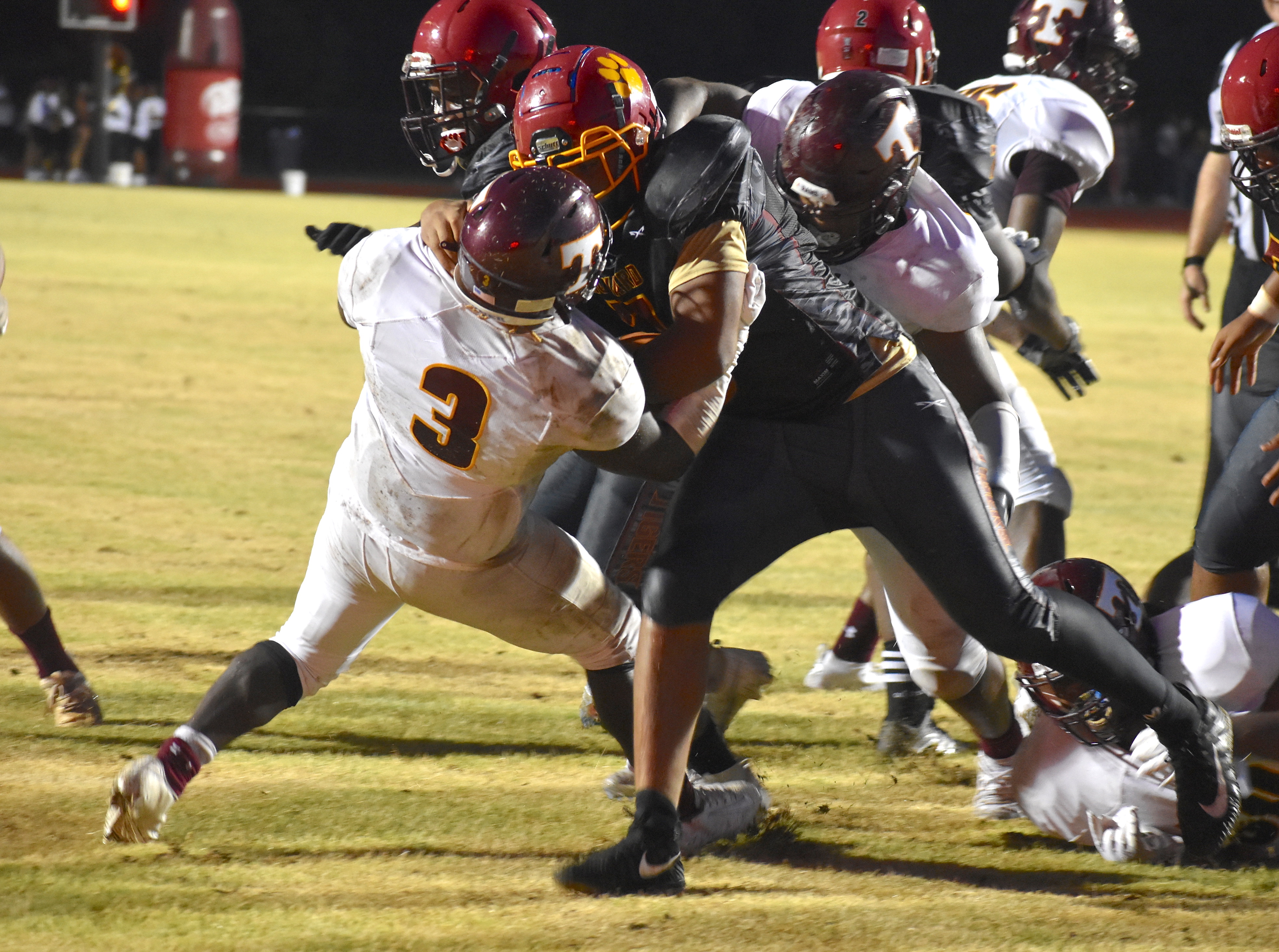 Staff photo by Patrick MacCoon / Tyner's Deonta Talor brings down the ball carrier during the Rams season opening win over Howard on Friday night.