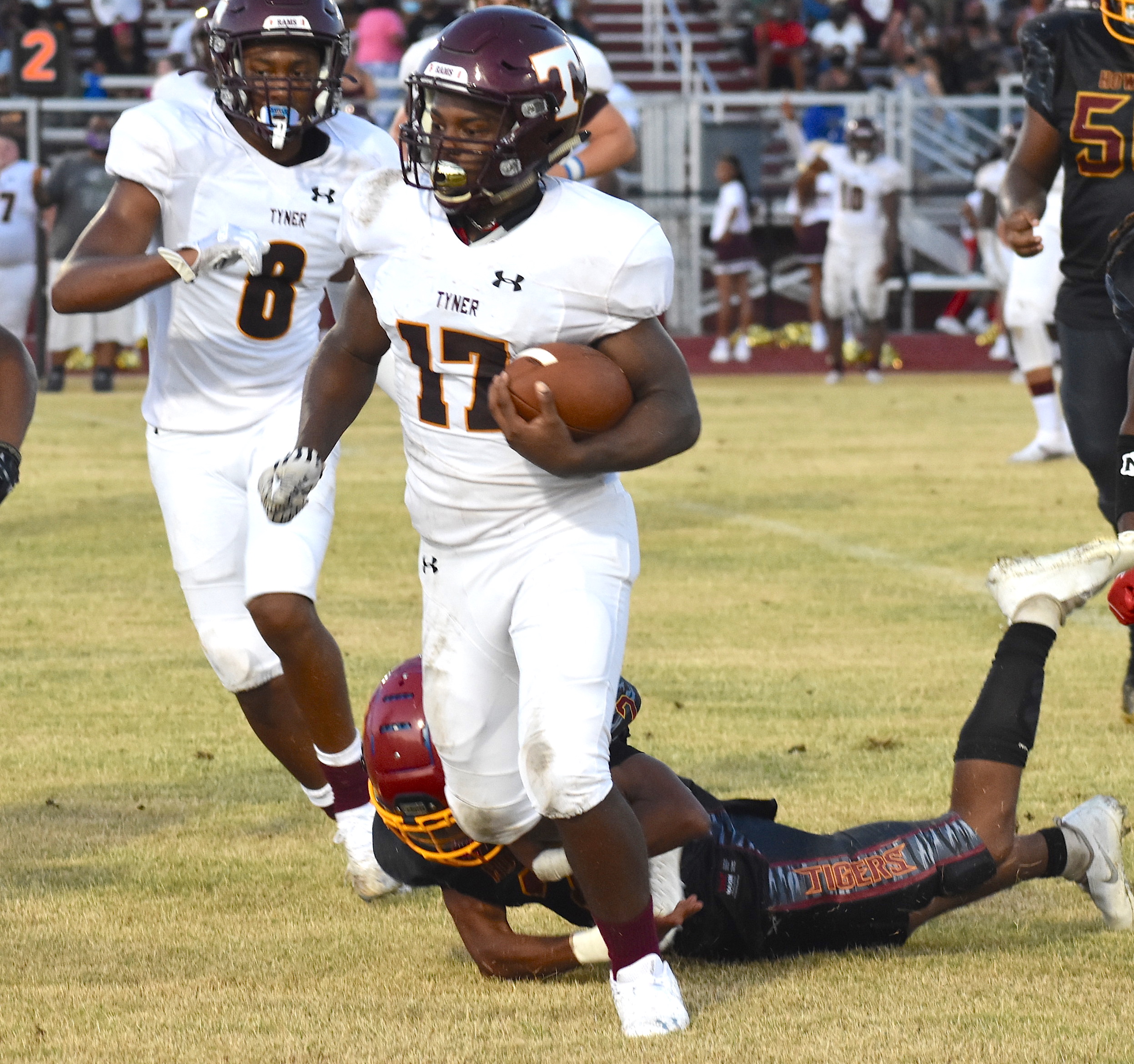 Staff photo by Patrick MacCoon / Tyner senior running back Javell Woodruff picks up solid yardage on the ground during Friday night's road win over Howard.