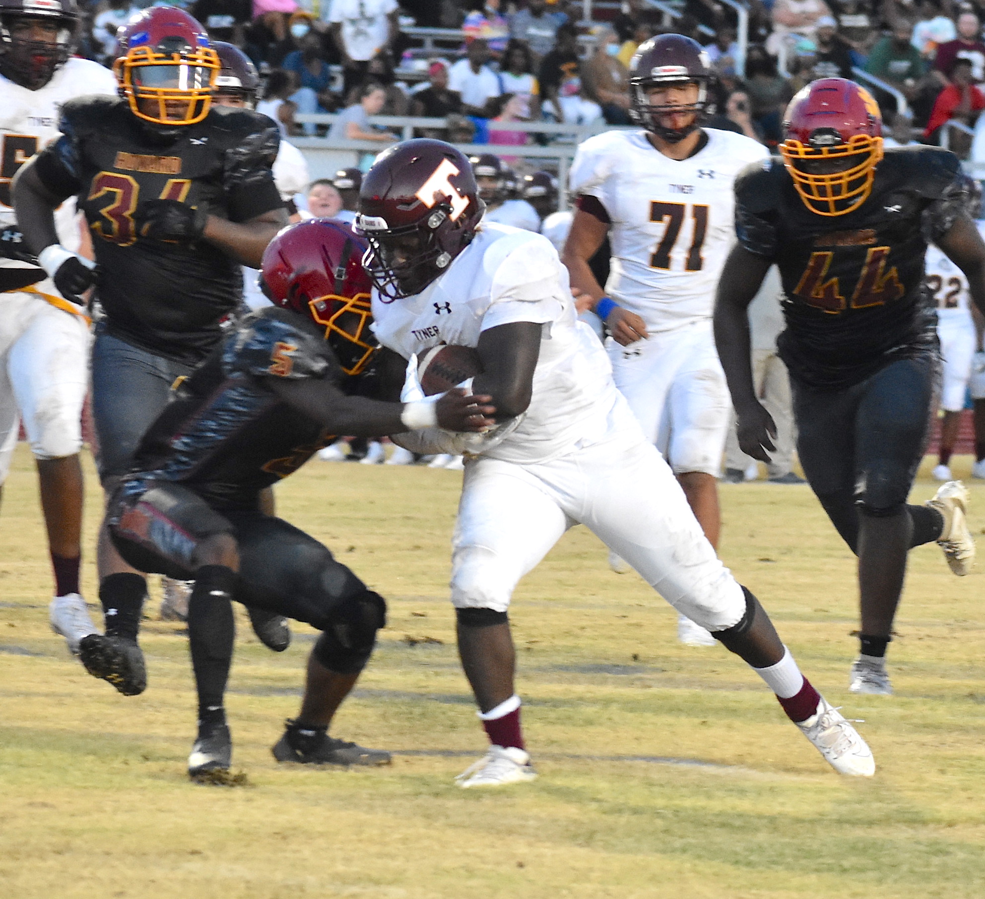 Staff photo by Patrick MacCoon / Tyner's Deonta Talor overpowers a defender for a touchdown run during Friday night's road win over Howard.