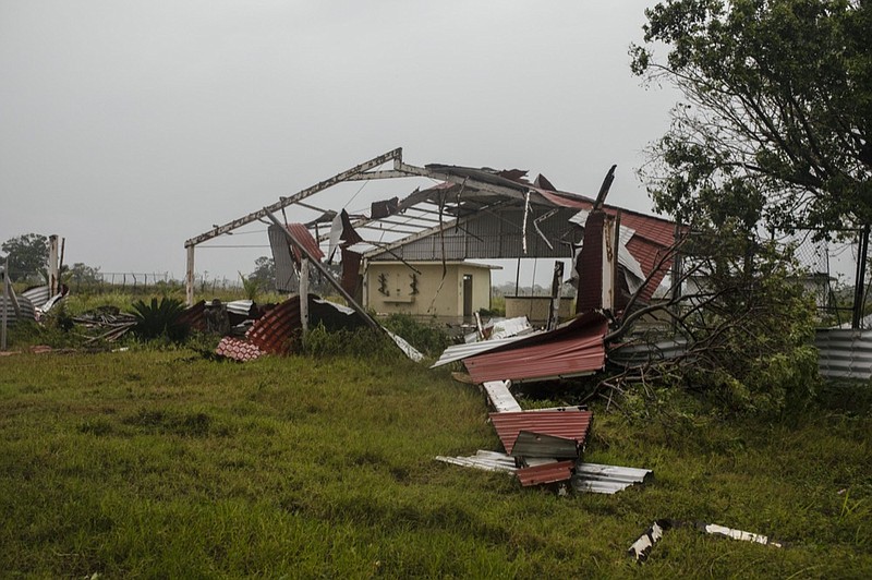 Pieces of roof lay on the ground in the aftermath of Hurricane Grace, in Tecolutla, Veracruz State, Mexico, Saturday, Aug. 21, 2021. (AP Photo/Felix Marquez)

