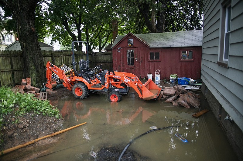 The back yard of a house is seen partially flooded during the passing of Tropical Storm Henri in Helmetta, N.J., Monday, Aug. 23, 2021. (AP Photo/Eduardo Munoz Alvarez)