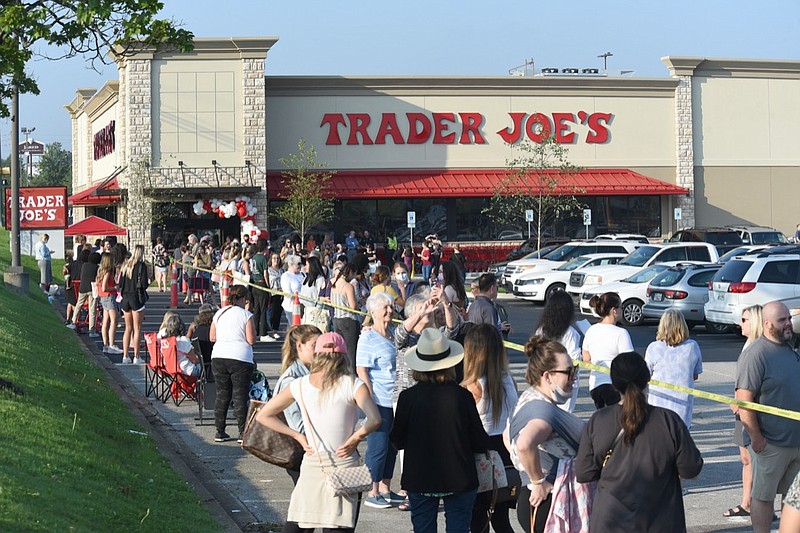 Staff Photo by Matt Hamilton / Shoppers wait in line outside the Trader Joe's on Gunbarrel Road on Wednesday. Some customers lined up as early as 6 a.m. The Trader Joe's grocery store held a grand opening on Wednesday, August 25, 2021.