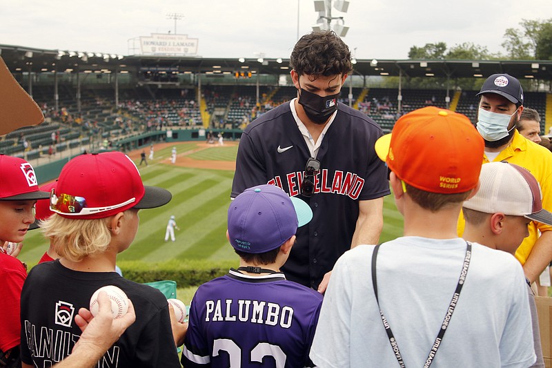 AP photo by Tom E. Puskar / Cleveland Indians outfielder Bradley Zimmer signs autographs for fans on the hill in right field at Lamade Stadium during the Little League World Series on Sunday in South Williamsport, Pa.