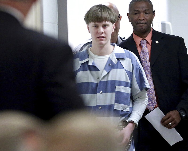 In this April 10, 2017, file photo, Dylann Roof enters the court room at the Charleston County Judicial Center to enter his guilty plea on murder charges in Charleston, S.C. A federal appeals court on Wednesday, Aug. 25, 2021, upheld Roof's conviction and sentence on federal death row for the 2015 racist slayings of nine members of a Black South Carolina congregation. A three-judge panel of the 4th U.S. Circuit Court of Appeals in Richmond affirmed Roof's conviction and sentence in the shootings at Mother Emanuel AME Church in Charleston. (Grace Beahm/The Post And Courier via AP, Pool, File)