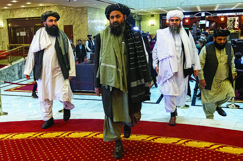 Taliban co-founder Mullah Abdul Ghani Baradar, center, arrives with other members of the Taliban delegation for an international peace conference in Moscow, Russia, in March. / AP Photo/Alexander Zemlianichenko, Pool