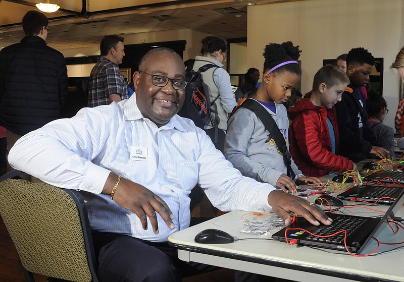 Staff file photo / Chris Ramsey in 2017 with Naomi Williams, Reagan Williams and Aaron Williams at a Tech Town pop-up event at the Bessie Smith Hall.