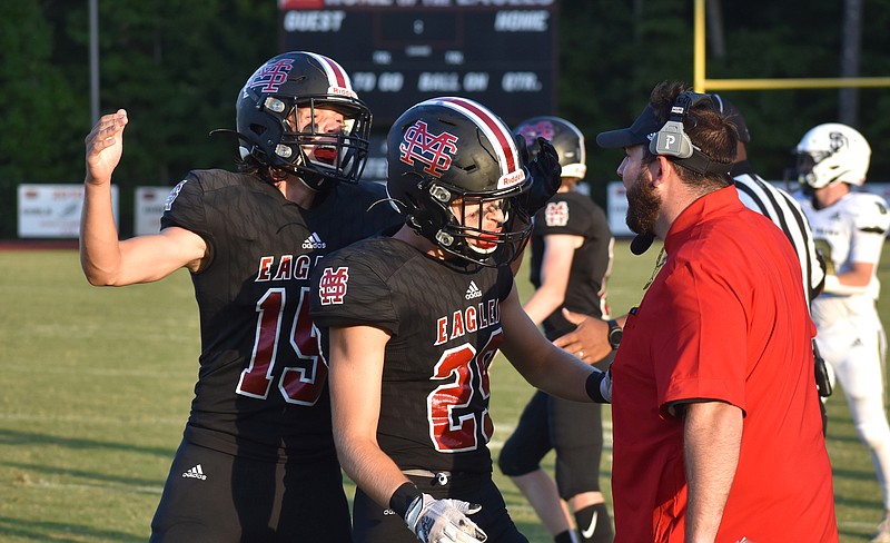 Staff photo by Patrick MacCoon / Signal Mountain's Logan Farr is congratulated on the sideline after making a hard hit early in Friday's home matchup against Soddy-Daisy.