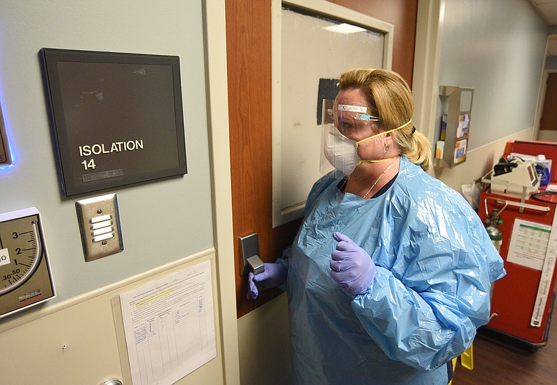 Staff Photo by Matt Hamilton / Nurse Emily Seiter enters an isolation room in full PPE at Parkridge Medical Center on Friday, Aug. 27, 2021.