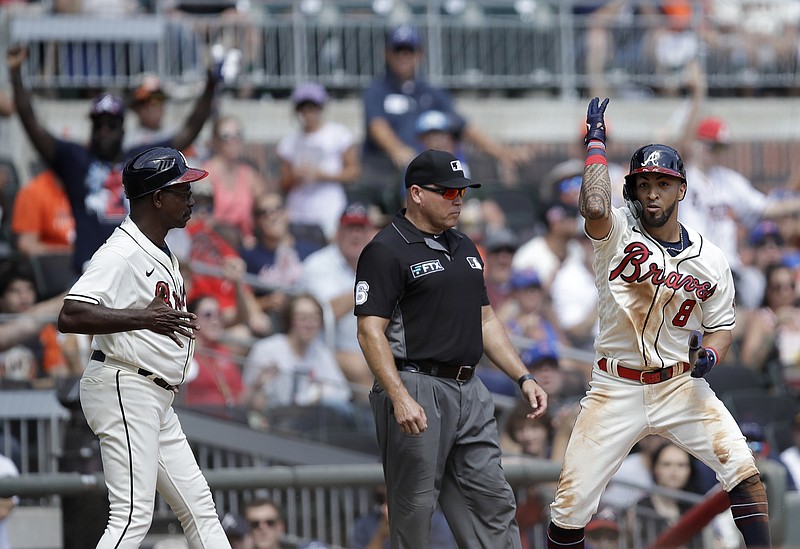 AP photo by Ben Margot / Atlanta Braves left fielder Eddie Rosario, right, celebrates after hitting a two-run triple against the visiting San Francisco Giants during the sixth inning Sunday. The Braves won 9-0 and took two of three in a series against the team with MLB's best current record.