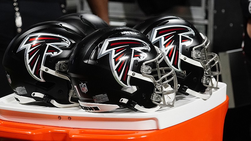 AP photo by John Bazemore / Atlanta Falcons helmets sit on the sidelines during a preseason game against the Cleveland Browns on Aug. 29, 2021, in Atlanta.