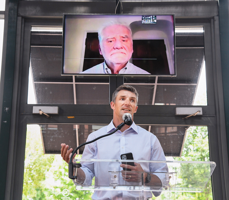 Photography by Mark Gilliland / Matt Gregory of Lockton Companies introduces virtual speaker Henry Hummert of CMA Consulting