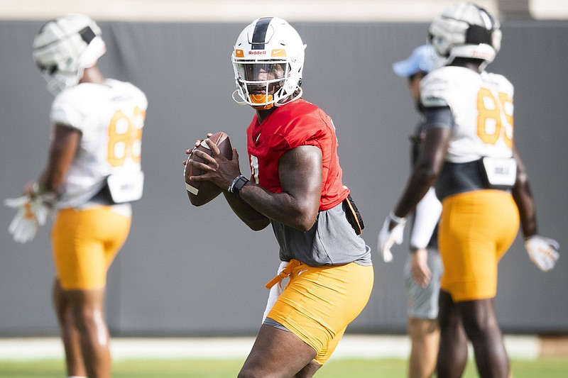 Tennessee quarterback Joe Milton throws during an NCAA college football practice Aug. 20, 2021, in Knoxville, Tenn. Tennessee coach Josh Heupel has named Milton, a transfer from Michigan, as his starting quarterback for the Volunteers' season opener Thursday night. (Brianna Paciorka/News Sentinel via AP)