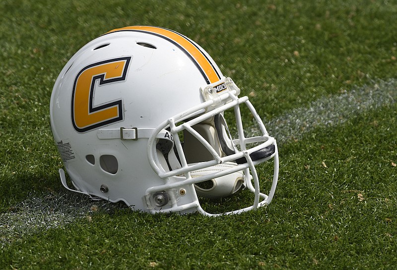 Staff file photo / A UTC helmet is seen on the field at football practice at Scrappy Moore Field on Wednesday, Apr. 6, 2016, in Chattanooga, Tenn.