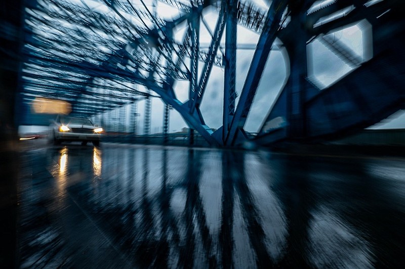 Staff photo by Troy Stolt / A car drives through the rain on the Market Street Bridge on Tuesday, Aug. 31, 2021 in Chattanooga, Tenn.
