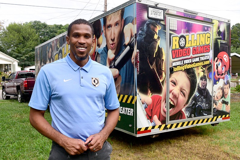 Staff Photo by Robin Rudd / Montrell Besley bought a video game trailer in May and has a business taking it to events, in addition to his day job at Chattanooga Prep. Besley posed for a portrait with his trailer.