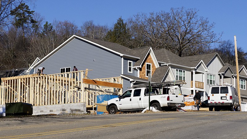 Staff file photo / Builders work on home construction along Hedgewood Drive in Chattanooga earlier this year.