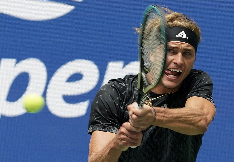 Alexander Zverev, of Germany, returns a shot to Sam Querrey, of the United States, during the first round of the US Open tennis championships, Tuesday, Aug. 31, 2021, in New York. (AP Photo/John Minchillo)