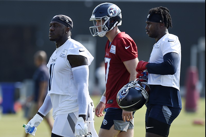 FILE - Tennessee Titans wide receiver A.J. Brown (11), quarterback Ryan Tannehill (17) and Julio Jones (2) take a break during NFL football training camp in Nashville, Tenn., in this Wednesday, July 28, 2021, file photo. Wide receiver A.J. Brown campaigned on social media for the Titans to make Julio Jones his teammate. (AP Photo/Mark Zaleski, File)