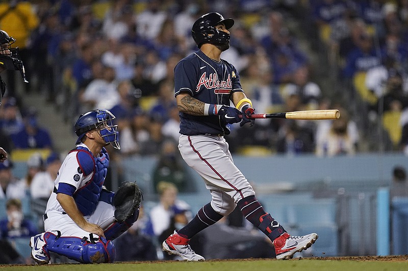 AP photo by Marcio Jose Sanchez / Atlanta Braves outfielder Eddie Rosario watches his two-run homer during the seventh inning of Wednesday night's game against the host Los Angeles Dodgers.