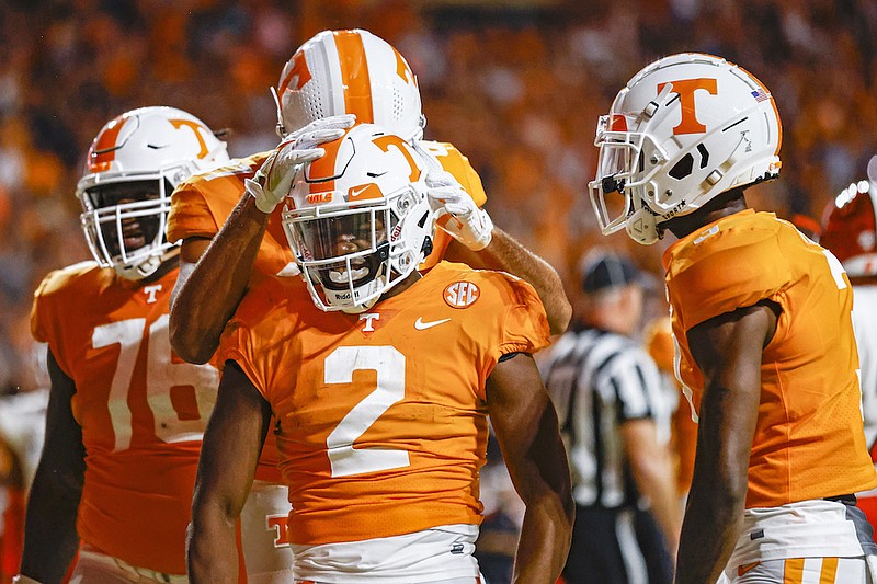 Tennessee running back Jabari Small (2) celebrates a touchdown against Bowling Green with teammates during the first half of an NCAA college football game Thursday, Sept. 2, 2021, in Knoxville, Tenn. (AP Photo/Wade Payne)