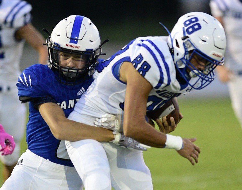 Staff photo by Robin Rudd / Sale Creek's Lucas Mathis, left, tackles a Jackson County player during Friday night's game.