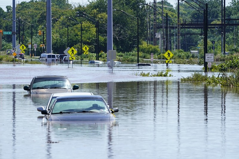 Vehicles are under water during flooding in Norristown, Pa. Thursday, Sept. 2, 2021 in the aftermath of downpours and high winds from the remnants of Hurricane Ida that hit the area. (AP Photo/Matt Rourke)


