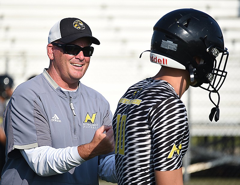 Staff photo by Matt Hamilton / North Murray football coach Preston Poag talks to quarterback Seth Griffin during a summer scrimmage in Calhoun, Ga. North Murray opened its season Friday night with a 31-30 win against Northwest Whitfield.